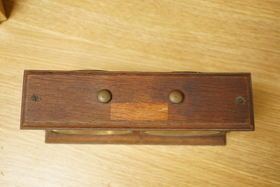 A William Tanner 'The Reliable Chess Timer' in an oak case, stamped to the reverse ‘HAO Make, Made in Wurttemberg’. Condition - fair to good.